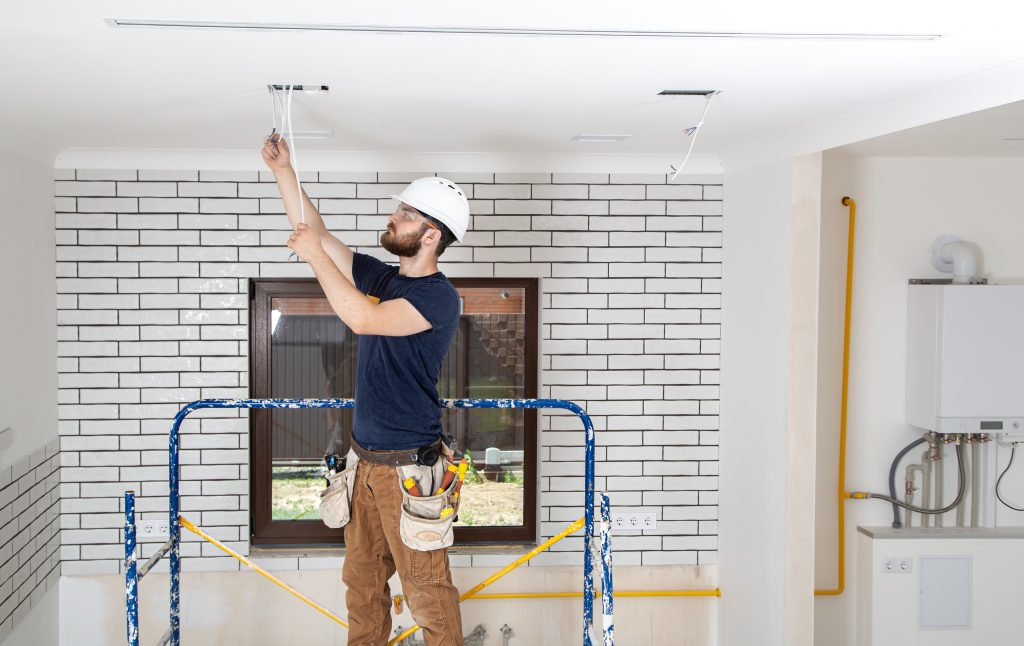 professional-overalls-with-tools-background-repair-site-home-renovation-concept